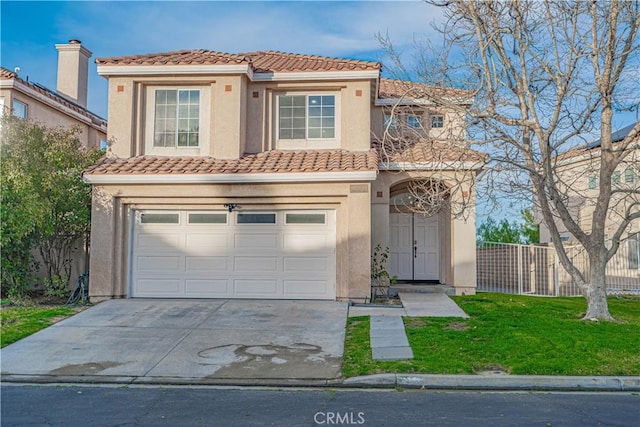 view of front of property with a tiled roof, fence, and stucco siding