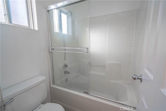 full bathroom with toilet and enclosed tub / shower combo