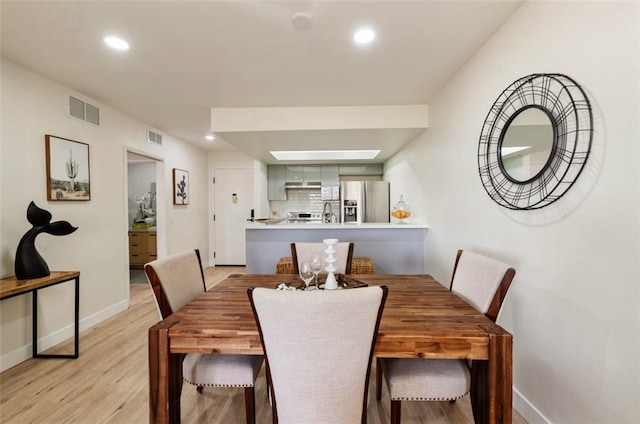 1745 Camino Palmero St Unit 537, Los Angeles, CA 90046 - dining space featuring recessed lighting, baseboards, and light wood finished floors