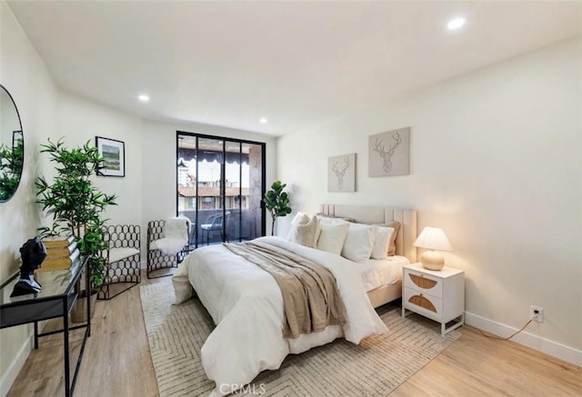 1745 Camino Palmero St Unit 537, Los Angeles, CA 90046 - bedroom featuring baseboards, wood finished floors, and recessed lighting