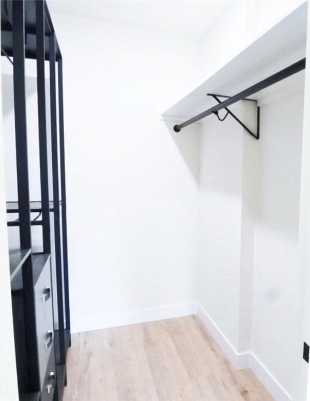 1745 Camino Palmero St Unit 537, Los Angeles, CA 90046 - spacious closet with wood finished floors