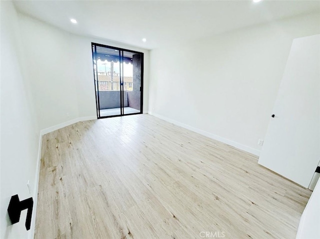 1745 Camino Palmero St Unit 537, Los Angeles, CA 90046 - unfurnished room featuring wood finished floors, baseboards, and recessed lighting