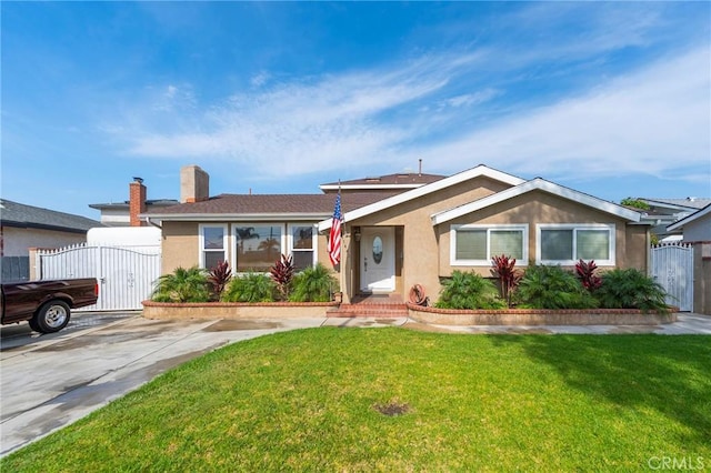 ranch-style home featuring a front yard, fence, a gate, and stucco siding