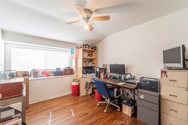 office area with vaulted ceiling, wood finished floors, a ceiling fan, and baseboards