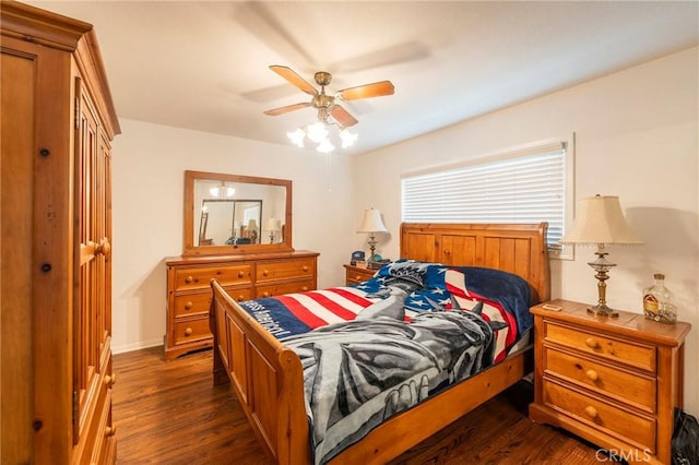 bedroom with dark wood-type flooring and ceiling fan