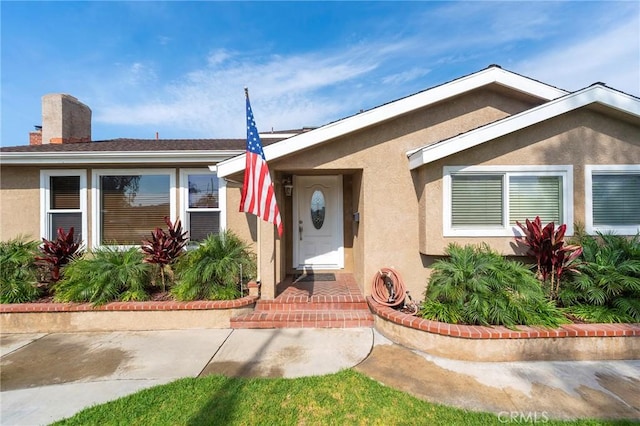 view of front of house featuring stucco siding