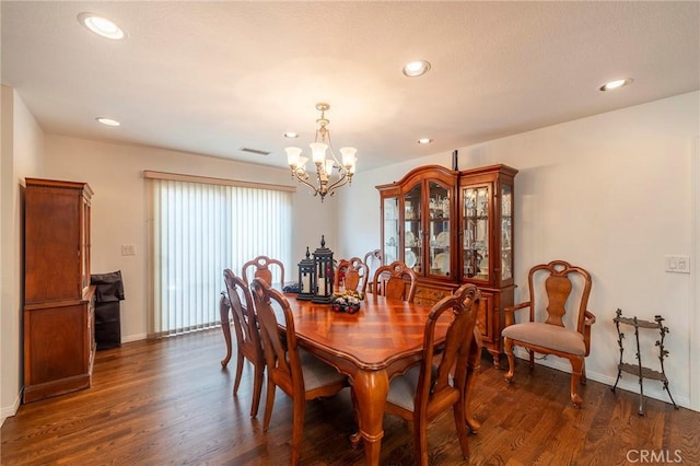 dining area with an inviting chandelier, visible vents, dark wood finished floors, and recessed lighting