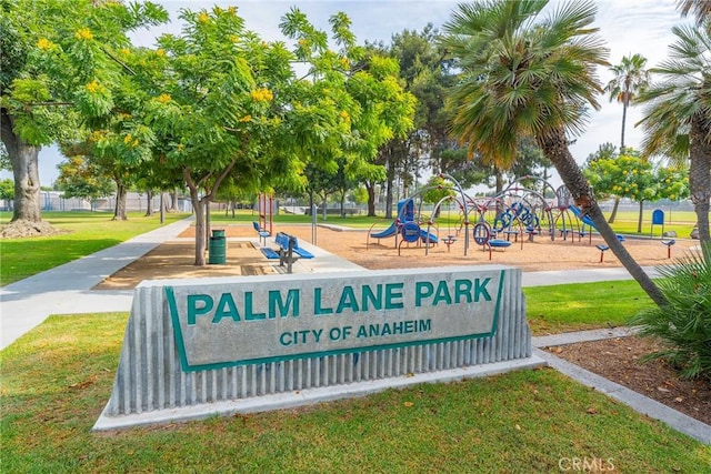 surrounding community featuring playground community and a lawn