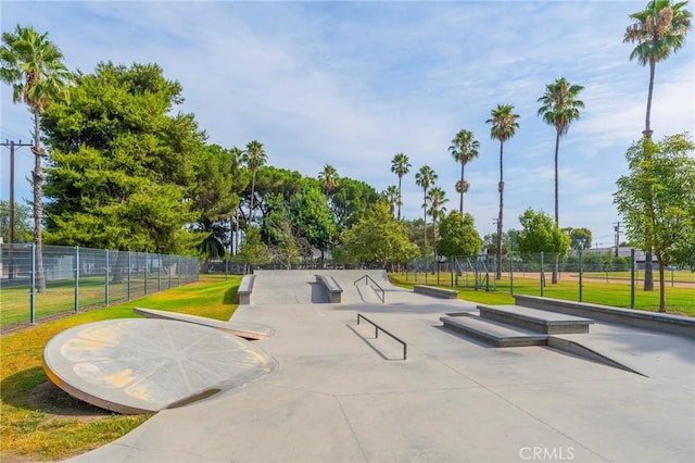 view of home's community featuring fence