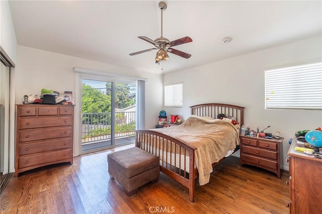 bedroom with access to exterior, ceiling fan, and wood finished floors