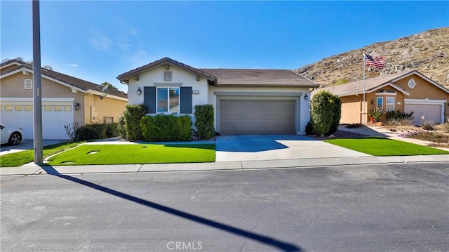 single story home featuring driveway, a tiled roof, an attached garage, a front lawn, and stucco siding