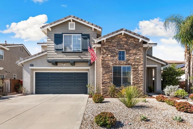 view of front facade with a garage, stone siding, concrete driveway, and stucco siding