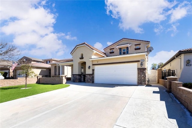 view of front of property featuring a garage, driveway, a gate, and stucco siding