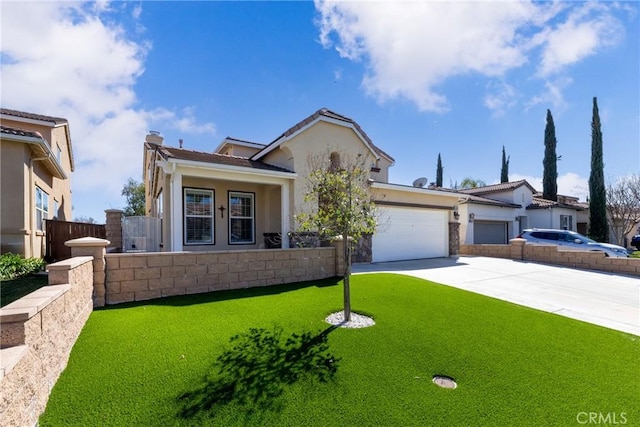 view of front of home with an attached garage, fence, driveway, stucco siding, and a front lawn