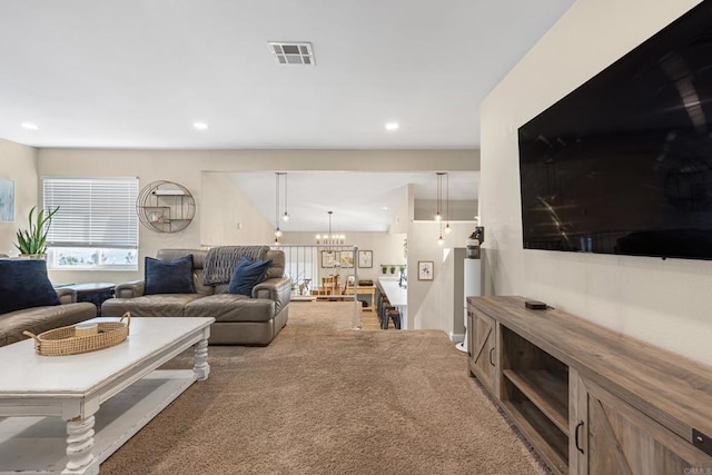 carpeted living room with recessed lighting, visible vents, a notable chandelier, and lofted ceiling