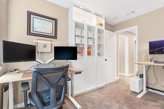 office space featuring light carpet and visible vents