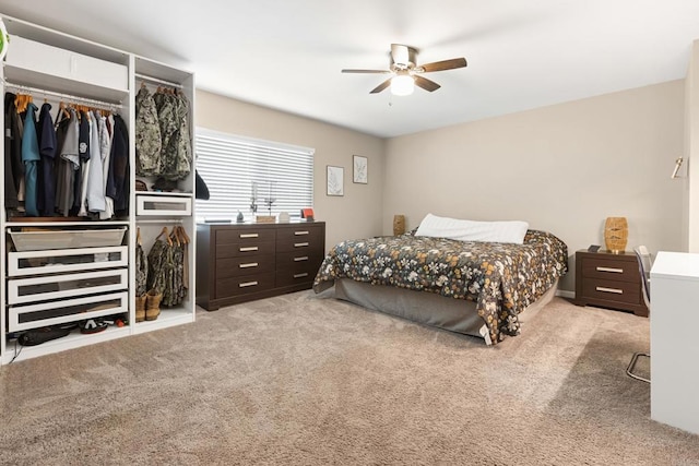 bedroom with a closet, carpet, and a ceiling fan