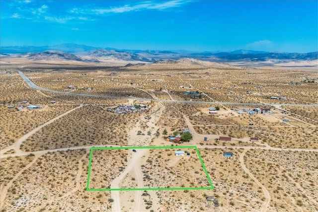 bird's eye view with view of desert and a mountain view