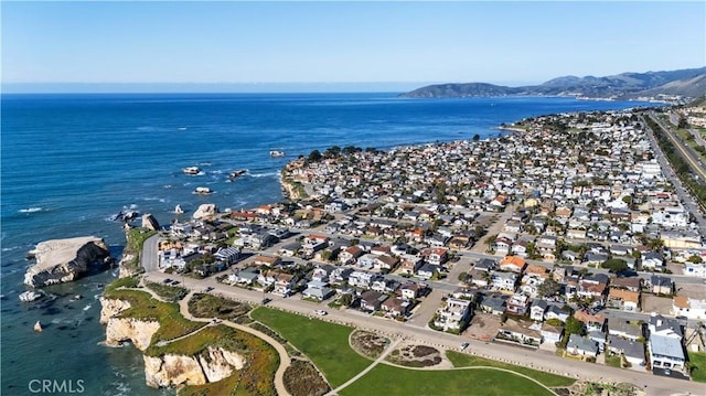 bird's eye view with a residential view and a water and mountain view