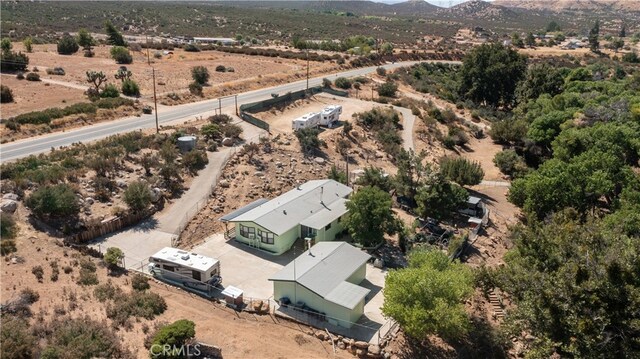 birds eye view of property featuring a mountain view