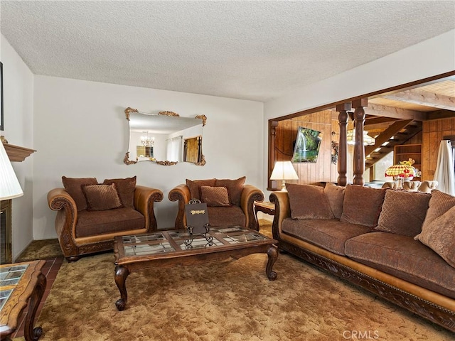 living room featuring a textured ceiling and a chandelier