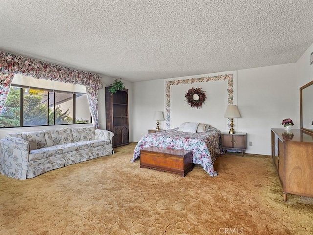 bedroom featuring a textured ceiling and light colored carpet