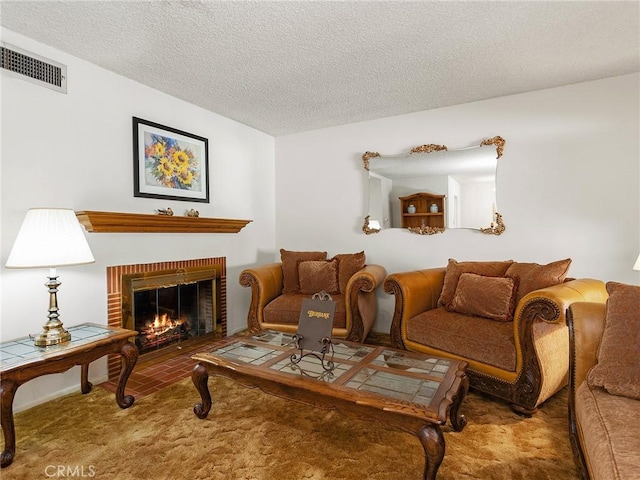 carpeted living room with a fireplace, visible vents, and a textured ceiling