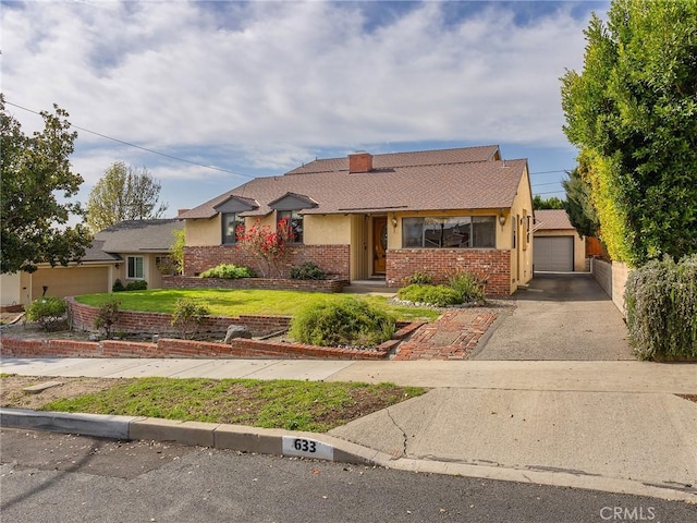 ranch-style home with a garage, brick siding, driveway, and a chimney