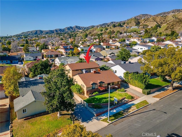 birds eye view of property with a residential view and a mountain view