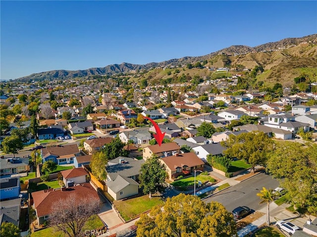 drone / aerial view featuring a residential view and a mountain view