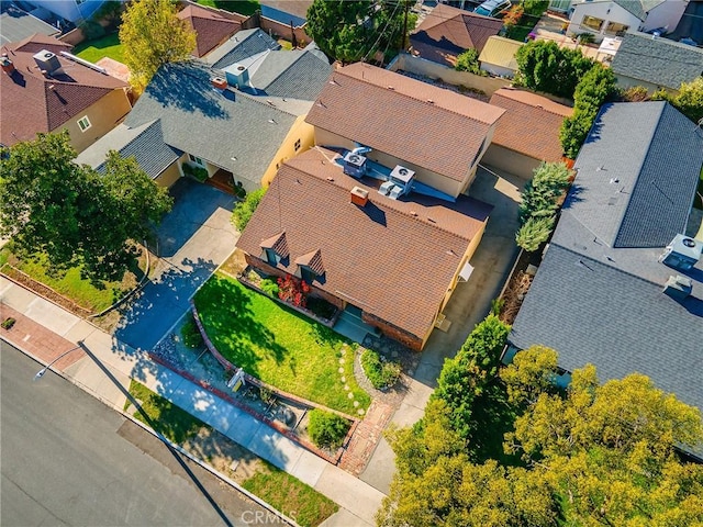 birds eye view of property with a residential view