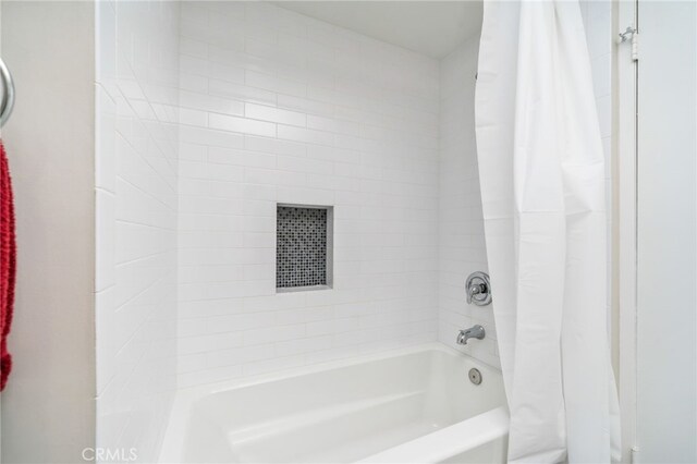 full bathroom with shower / bath combination with curtain