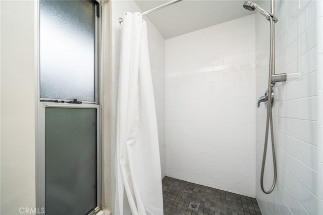 full bathroom featuring a shower stall