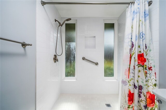 full bathroom featuring a shower stall