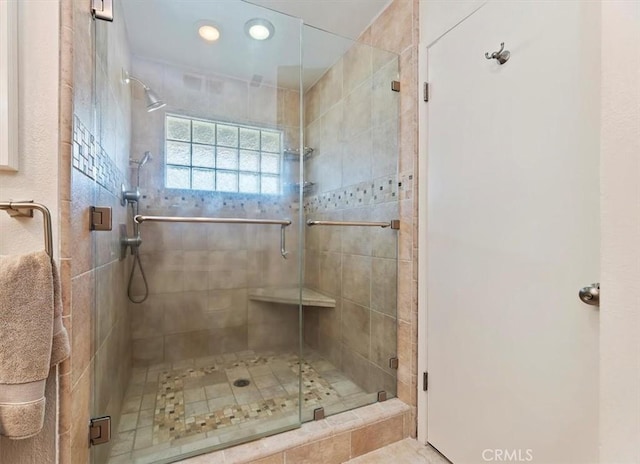 bathroom with a stall shower