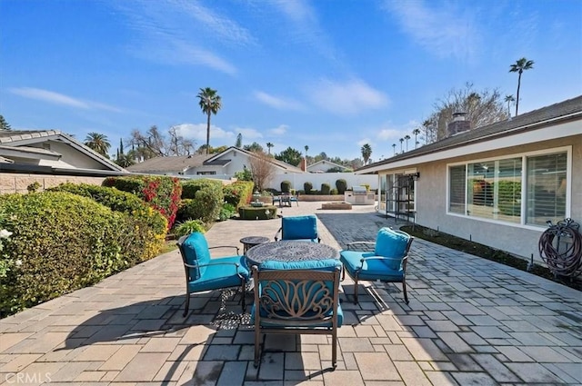 view of patio featuring outdoor dining space and a fenced backyard