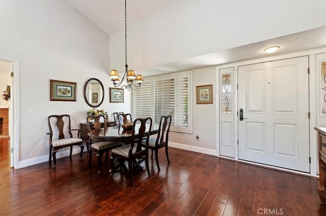 dining area with baseboards, high vaulted ceiling, dark wood-style flooring, and a notable chandelier