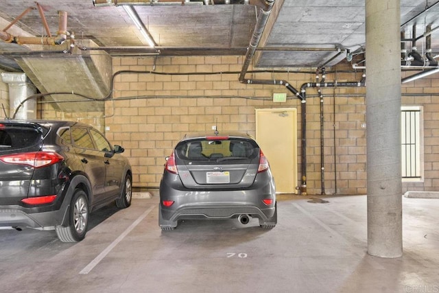 parking deck featuring concrete block wall