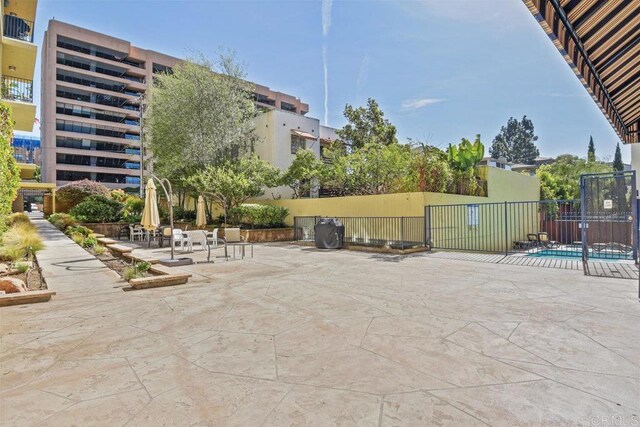 view of patio / terrace featuring fence