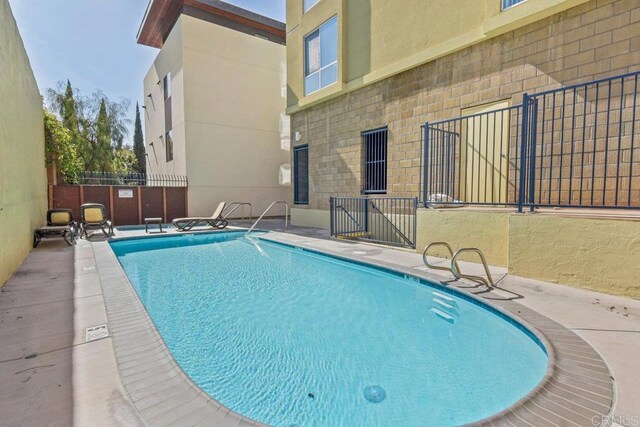 community pool with fence