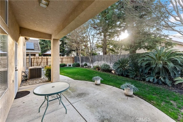 view of patio featuring cooling unit and a fenced backyard