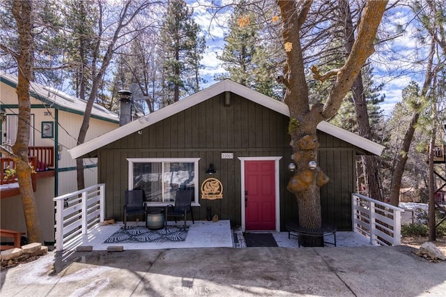 chalet / cabin with a patio