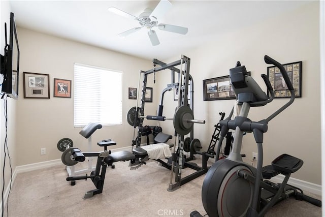 workout room featuring a ceiling fan, baseboards, and carpet flooring