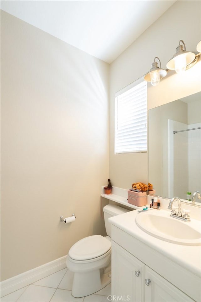 bathroom with tile patterned floors, toilet, and vanity