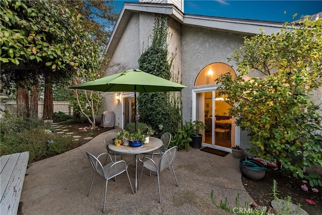 view of patio featuring fence and outdoor dining area