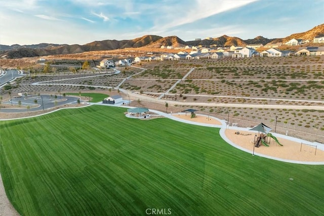 birds eye view of property featuring a mountain view