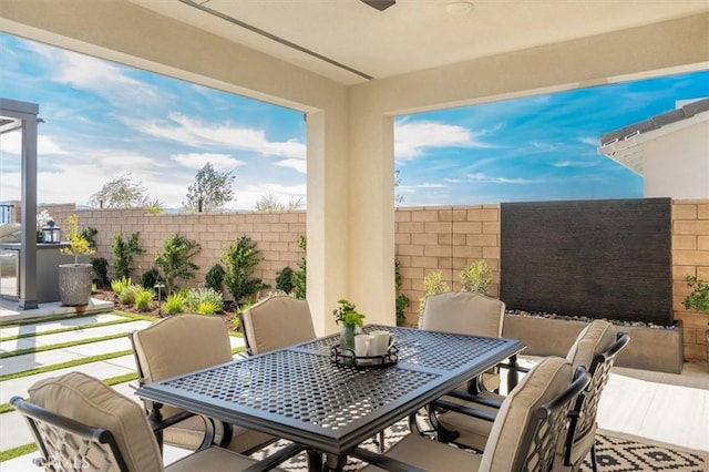 view of patio / terrace featuring outdoor dining area and a fenced backyard