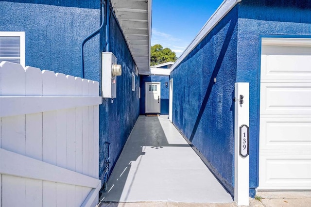 view of side of home featuring a garage