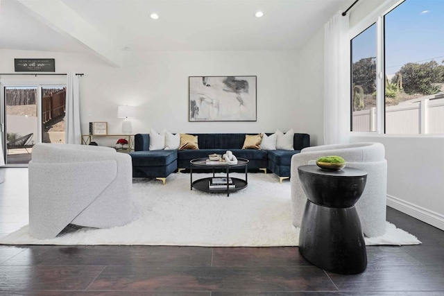 living room featuring dark wood-style floors, baseboards, and recessed lighting