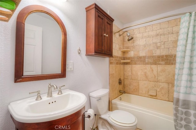 bathroom with shower / bath combo, vanity, and toilet